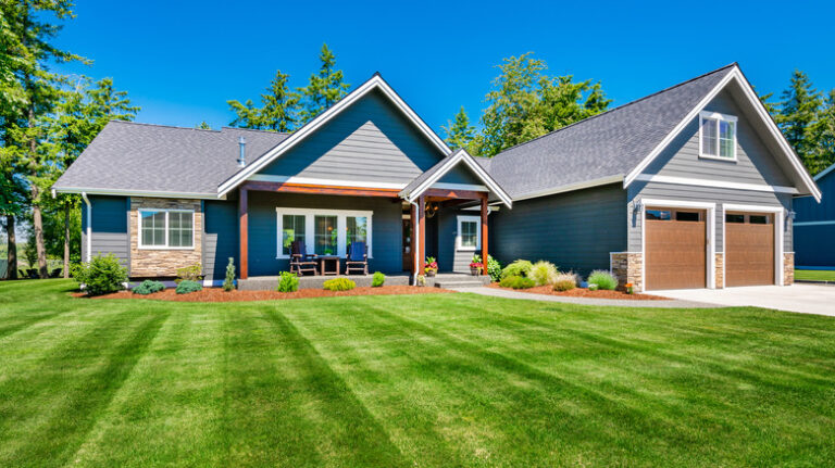 Craftsman,home,with,double,garage,lush,green,lawn,and,blue